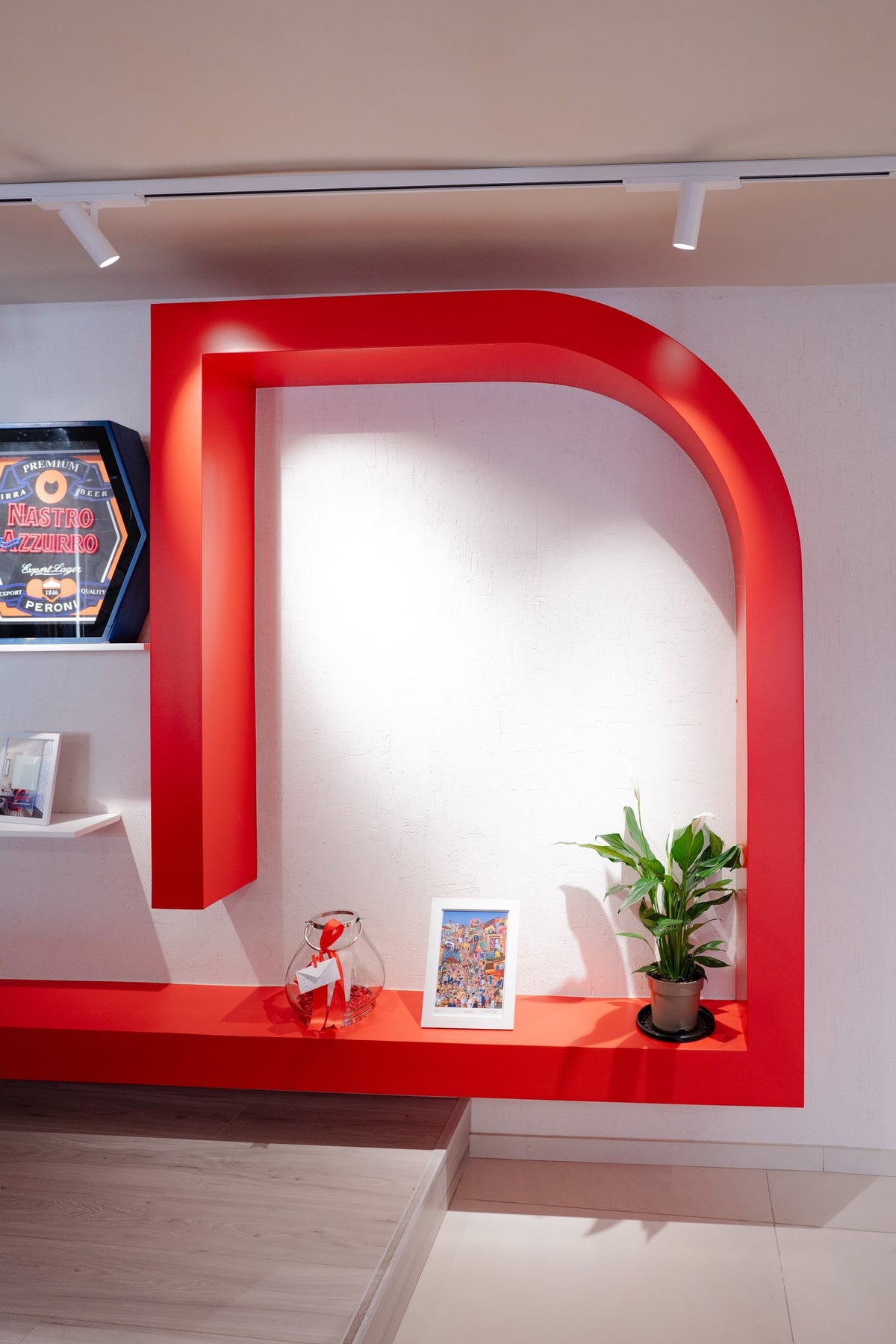 White Decora Raffaello Venetian Plaster wall framed by a red architectural feature